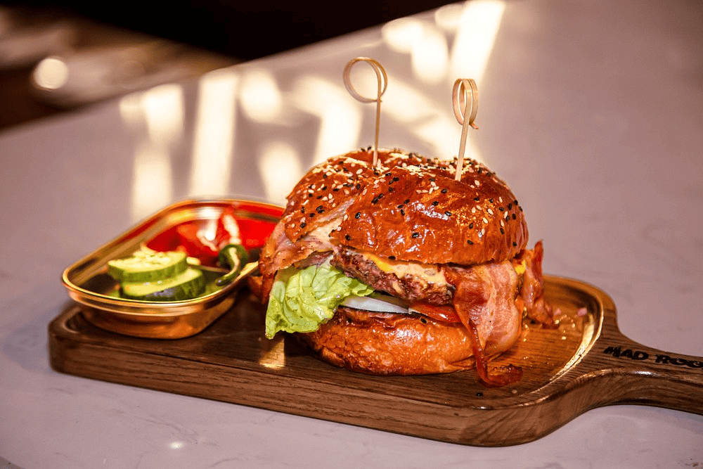 Generously sized burgers at MAD ROOSTA are crafted with quality ingredients and rich, well-developed flavors (Source: Tripadvisor - Mad Roosta | Burgers & Grill)